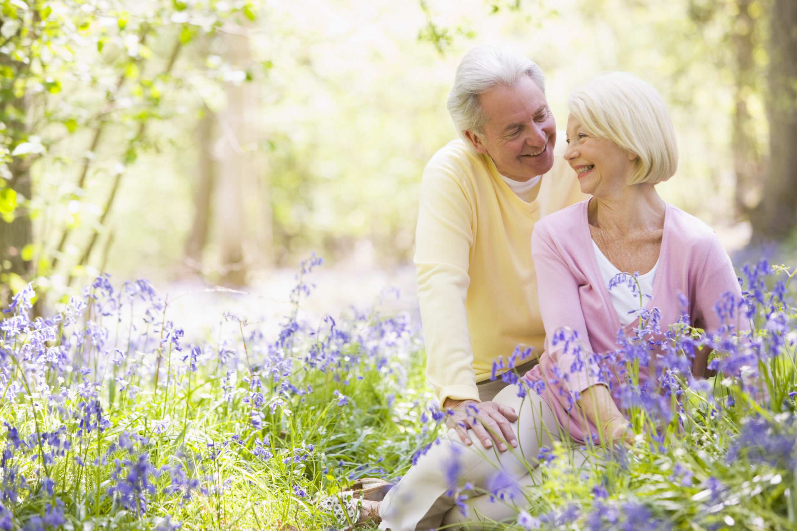 elderly couple looking happy and enjoying time together outdoors